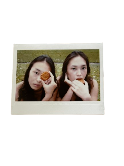 Two friends holding yakgwa cookies