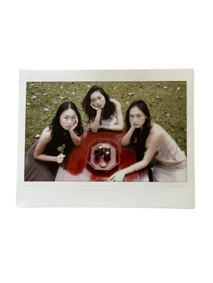 Three friends gathered around the tea table